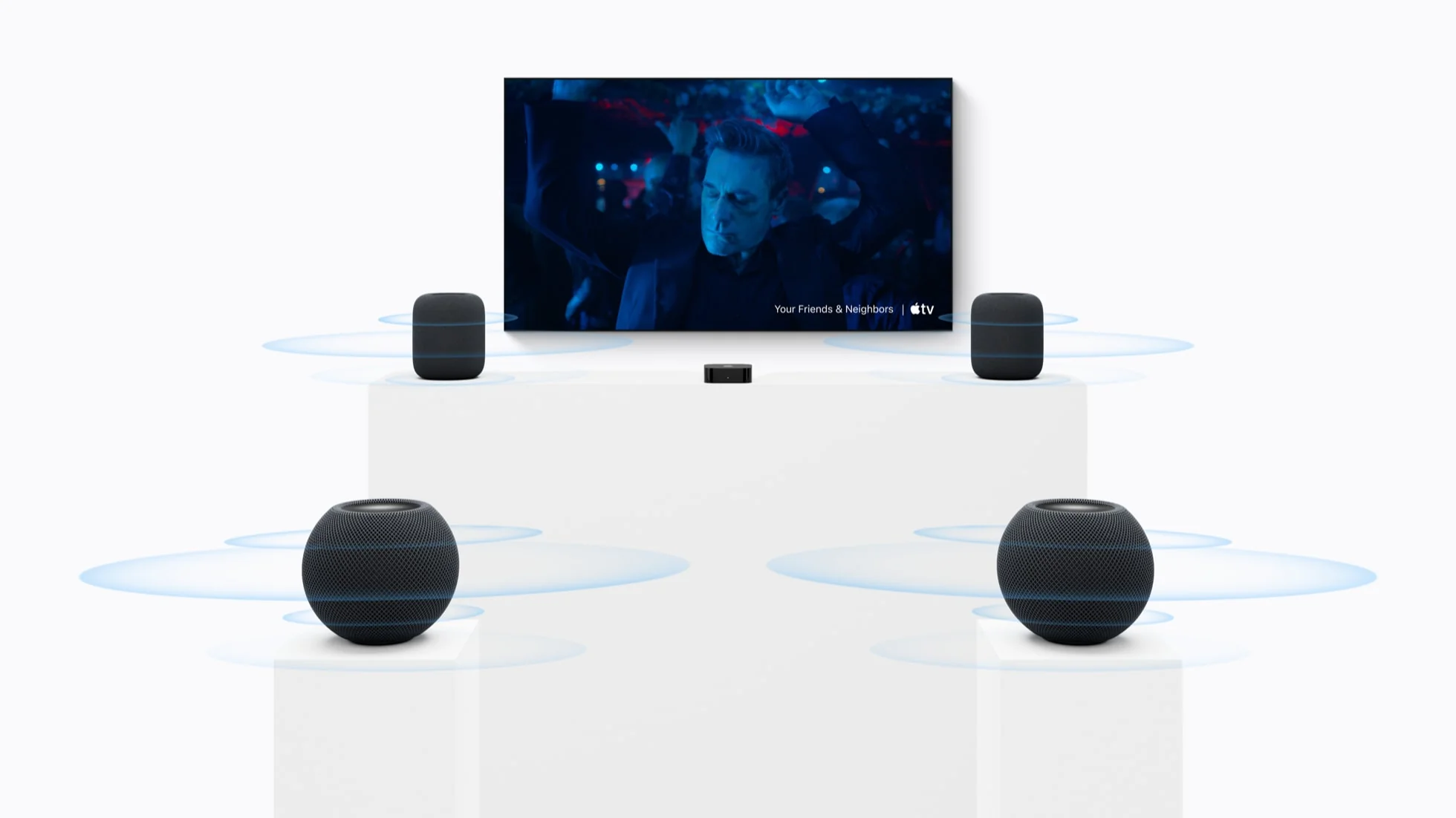 Home theatre setup with two HomePod (2nd generation) speakers at the front and two HomePod mini 2 speakers at the rear, with Apple TV 4K
